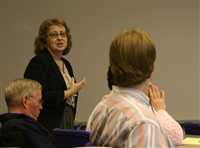 A presenter answering a question from the audience
